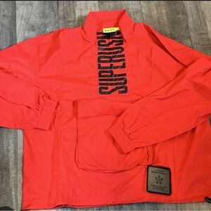 SUPERVSN new Red Jacket windbreaker rain folds into a bag Size S
Christmas